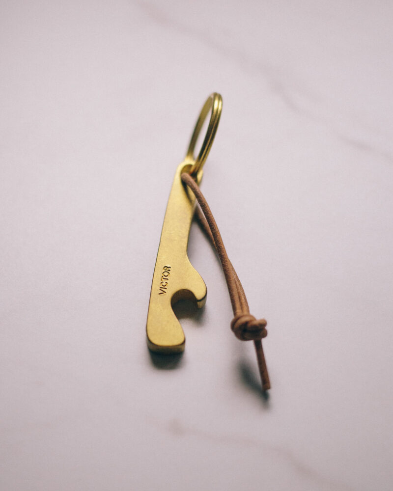 Victor bottle opener, key ring size, in natural brass