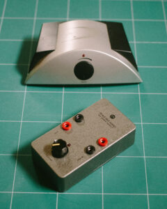 The original Sonic Impact T-amp and its new house, an enclosure created by Peace Out Audio